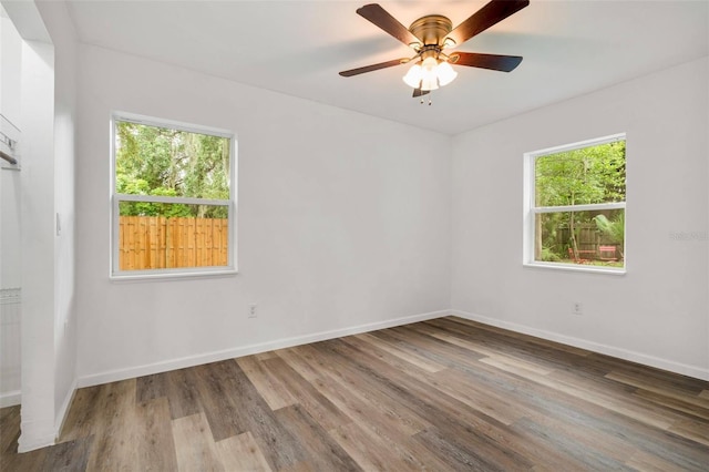 1604 NE 7th St, Gainesville, FL 32609 - unfurnished room with plenty of natural light, wood finished floors, and ceiling fan