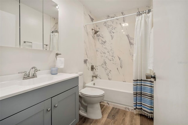 1604 NE 7th St, Gainesville, FL 32609 - bathroom featuring vanity, shower / tub combo with curtain, and wood finished floors