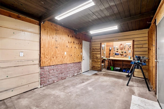 1604 NE 7th St, Gainesville, FL 32609 - below grade area featuring a workshop area and wooden walls