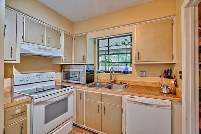 2510 NW 50th Pl, Gainesville, FL 32605 - kitchen featuring white appliances, under cabinet range hood, and light countertops