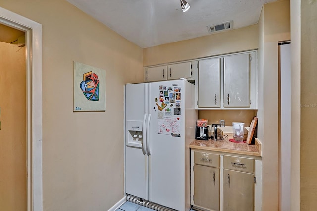 2510 NW 50th Pl, Gainesville, FL 32605 - kitchen with white refrigerator with ice dispenser and light countertops