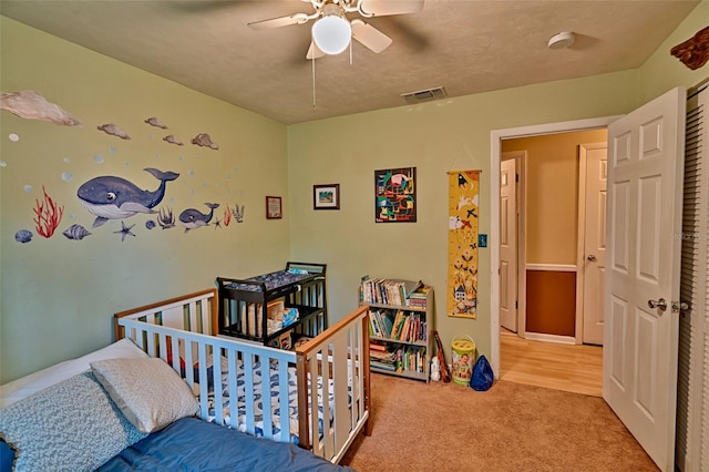 2510 NW 50th Pl, Gainesville, FL 32605 - carpeted bedroom with a ceiling fan
