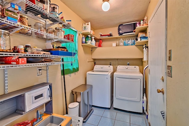 2510 NW 50th Pl, Gainesville, FL 32605 - laundry room featuring separate washer and dryer and light tile patterned flooring