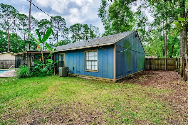 2510 NW 50th Pl, Gainesville, FL 32605 - view of property exterior with a fenced backyard and a sunroom