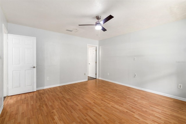 5 NW 28th Ter, Gainesville, FL 32607 - empty room with light wood finished floors and a ceiling fan