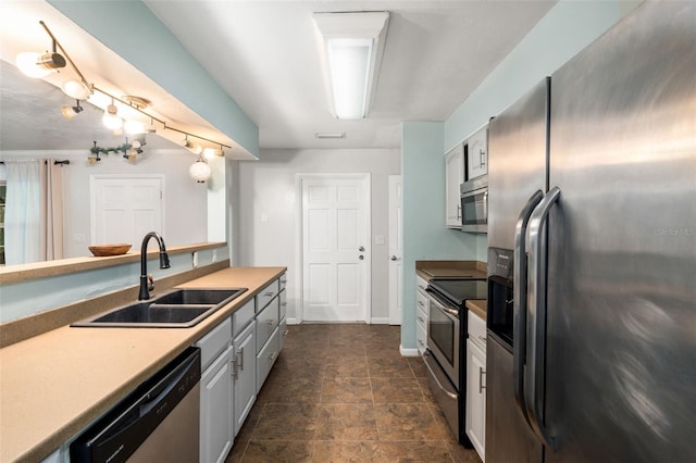 5 NW 28th Ter, Gainesville, FL 32607 - kitchen featuring appliances with stainless steel finishes, stone finish floors, and light countertops