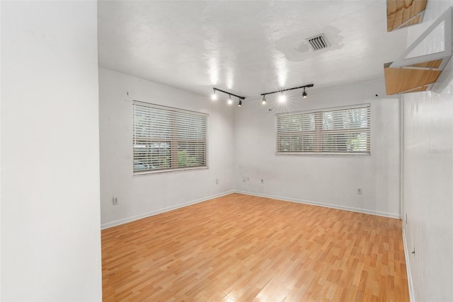 5 NW 28th Ter, Gainesville, FL 32607 - unfurnished room with light wood finished floors and track lighting