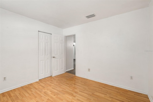 5 NW 28th Ter, Gainesville, FL 32607 - unfurnished bedroom featuring light wood finished floors and a closet
