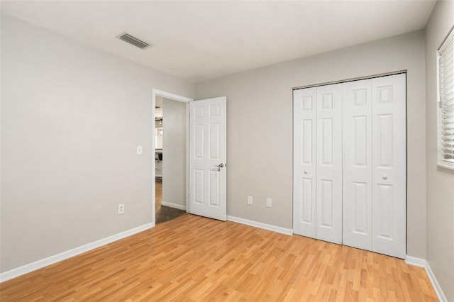 5 NW 28th Ter, Gainesville, FL 32607 - unfurnished bedroom featuring light wood-style floors and a closet