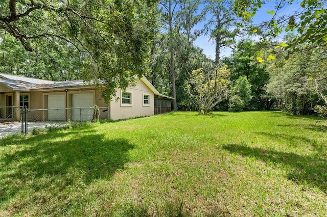 5 NW 28th Ter, Gainesville, FL 32607 - view of yard featuring an attached garage