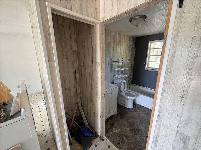 654 NE 2nd St, Crystal River, FL 34429 - full bathroom featuring vanity, stone finish flooring, and  shower combination