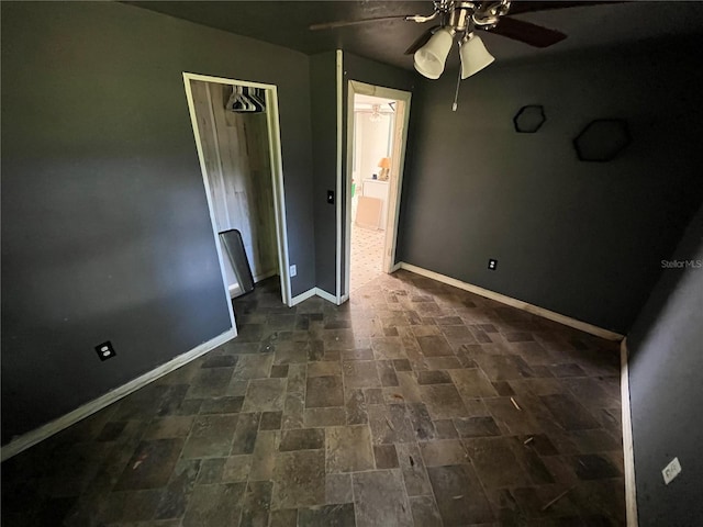 654 NE 2nd St, Crystal River, FL 34429 - unfurnished bedroom with brick patterned flooring and ceiling fan