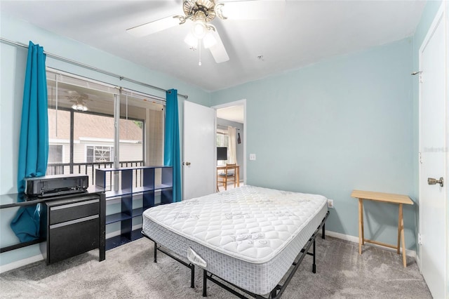 3800 SW 20th Ave Unit 210, Gainesville, FL 32607 - carpeted bedroom with baseboards and a ceiling fan