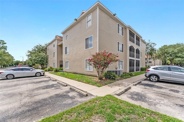3800 SW 20th Ave Unit 210, Gainesville, FL 32607 - view of building exterior with uncovered parking