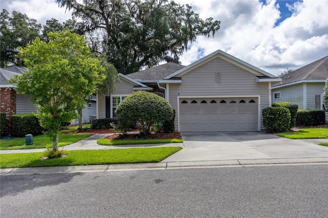 3737 SW 74th Dr, Gainesville, FL 32608 - view of front of home with concrete driveway and a garage