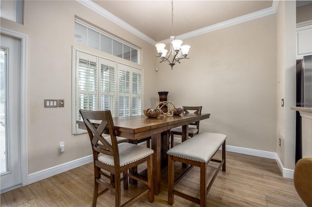 3737 SW 74th Dr, Gainesville, FL 32608 - dining area with light wood-type flooring, a chandelier, and crown molding