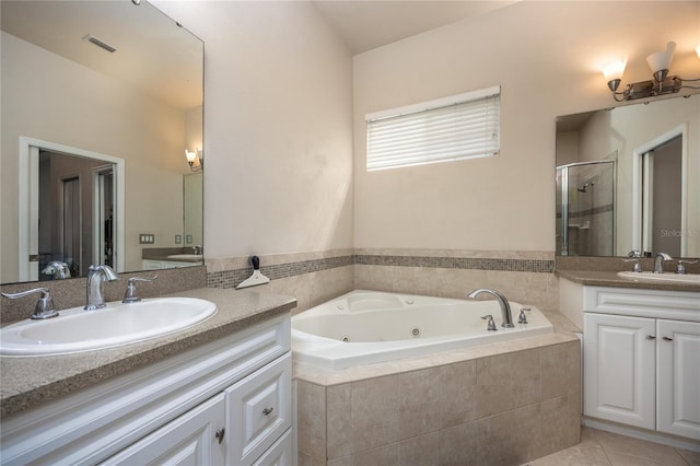 3737 SW 74th Dr, Gainesville, FL 32608 - full bathroom featuring a shower stall, a tub with jets, two vanities, and tile patterned flooring