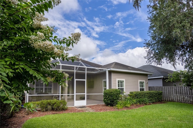 3737 SW 74th Dr, Gainesville, FL 32608 - rear view of property featuring glass enclosure and a shingled roof