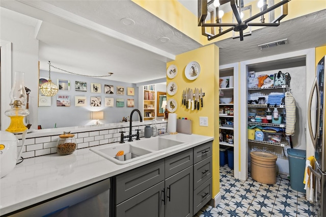 900 SW 62nd Blvd Unit H43, Gainesville, FL 32607 - kitchen featuring light floors, a chandelier, and light countertops
