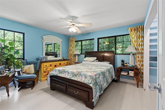900 SW 62nd Blvd Unit H43, Gainesville, FL 32607 - bedroom featuring ceiling fan and light wood-type flooring