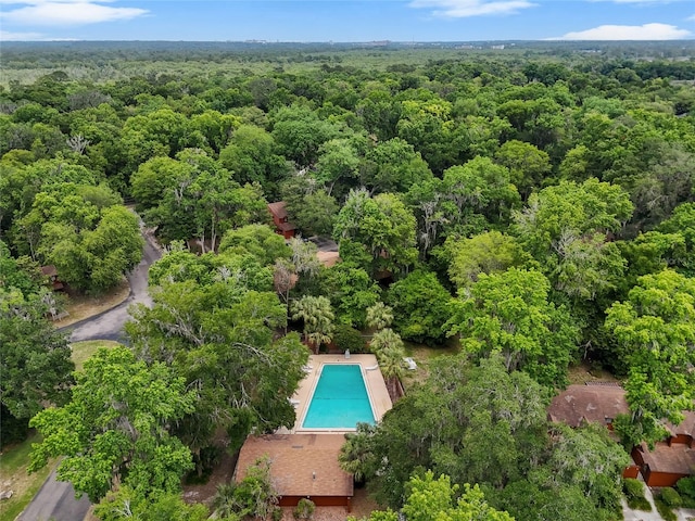 900 SW 62nd Blvd Unit H43, Gainesville, FL 32607 - aerial view of property's location featuring a forest and a pool