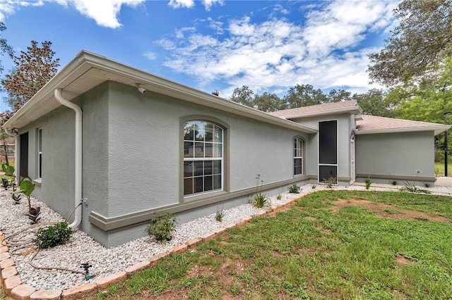 8198 N Brook Way, Citrus Springs, FL 34433 - rear view of house with stucco siding and a yard