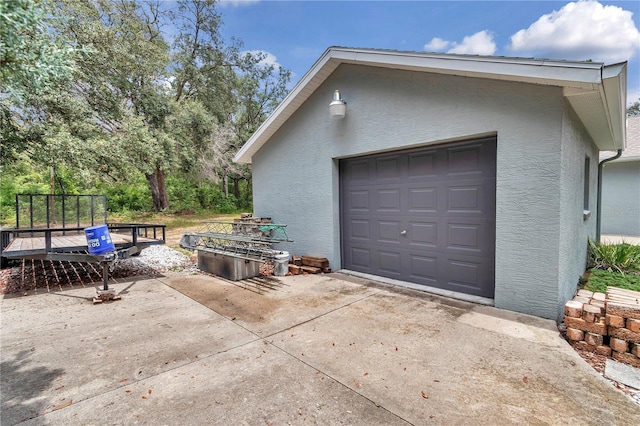 8198 N Brook Way, Citrus Springs, FL 34433 - detached garage featuring concrete driveway