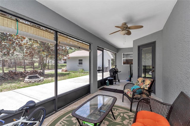 8198 N Brook Way, Citrus Springs, FL 34433 - sunroom featuring ceiling fan and an outdoor fire pit