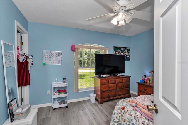 8198 N Brook Way, Citrus Springs, FL 34433 - bedroom featuring wood finished floors and ceiling fan
