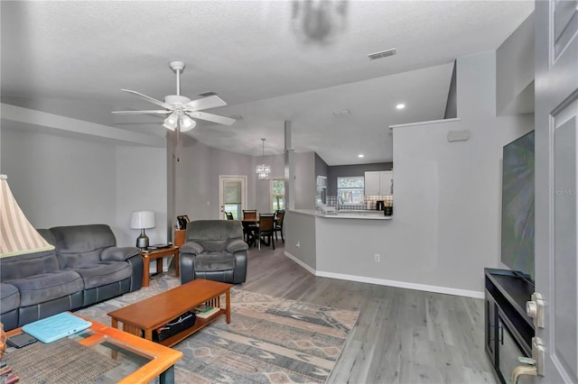 8198 N Brook Way, Citrus Springs, FL 34433 - living room with wood finished floors, ceiling fan, and vaulted ceiling