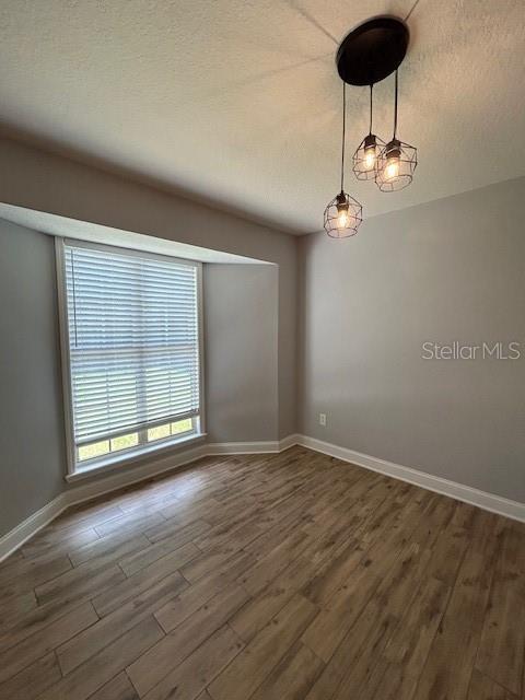3372 Penny Ln, Middleburg, FL 32068 - empty room featuring baseboards and wood finished floors