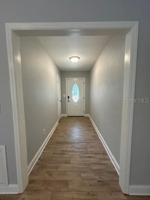 3372 Penny Ln, Middleburg, FL 32068 - entryway with wood finished floors and baseboards