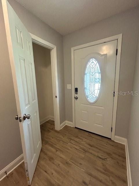 3372 Penny Ln, Middleburg, FL 32068 - foyer entrance with wood finished floors and baseboards