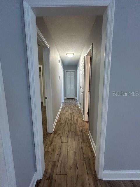 3372 Penny Ln, Middleburg, FL 32068 - corridor with dark wood-type flooring and baseboards