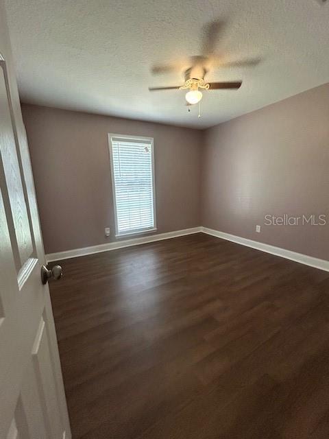 3372 Penny Ln, Middleburg, FL 32068 - unfurnished room featuring dark wood-type flooring and a ceiling fan