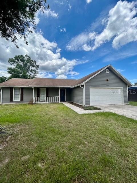 3372 Penny Ln, Middleburg, FL 32068 - ranch-style house featuring an attached garage, covered porch, a front lawn, and driveway