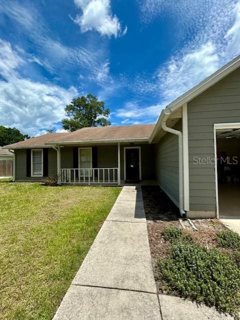 3372 Penny Ln, Middleburg, FL 32068 - view of front facade featuring a front lawn, covered porch, and a garage