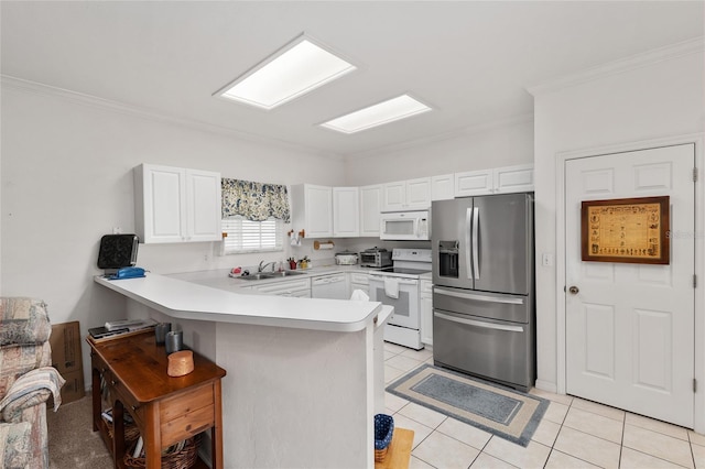 4814 NW 75th Rd, Gainesville, FL 32653 - kitchen featuring white appliances, a peninsula, ornamental molding, white cabinetry, and light tile patterned flooring