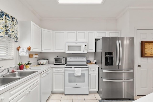 4814 NW 75th Rd, Gainesville, FL 32653 - kitchen featuring white appliances, crown molding, light tile patterned floors, light countertops, and white cabinets