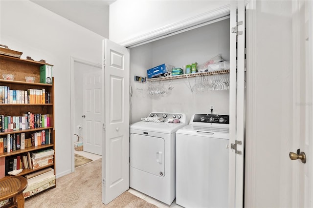 4814 NW 75th Rd, Gainesville, FL 32653 - washroom with washer and clothes dryer and light carpet