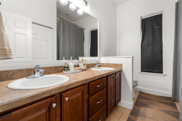 6326 SW 90th St, Gainesville, FL 32608 - bathroom with double vanity, tile patterned flooring, and a shower with curtain