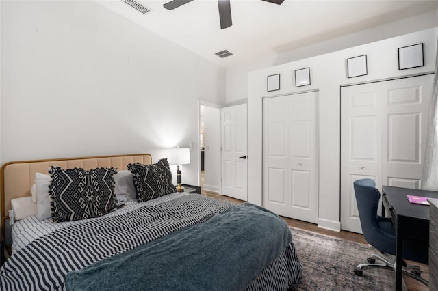 6326 SW 90th St, Gainesville, FL 32608 - bedroom with wood finished floors, a ceiling fan, two closets, and a desk