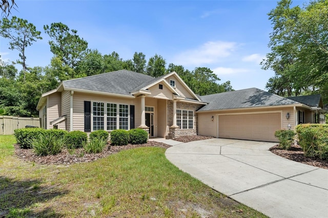6326 SW 90th St, Gainesville, FL 32608 - view of front facade featuring an attached garage, driveway, and a shingled roof