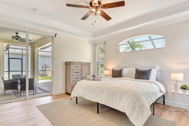 6364 Golden Eye Gln, Lakewood Ranch, FL 34202 - bedroom with access to exterior, light wood-type flooring, crown molding, and a ceiling fan