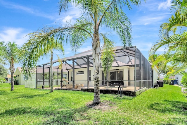 6364 Golden Eye Gln, Lakewood Ranch, FL 34202 - back of house with a yard, glass enclosure, and a patio area