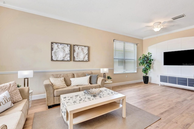 6364 Golden Eye Gln, Lakewood Ranch, FL 34202 - living room featuring ceiling fan, crown molding, and light wood-style flooring