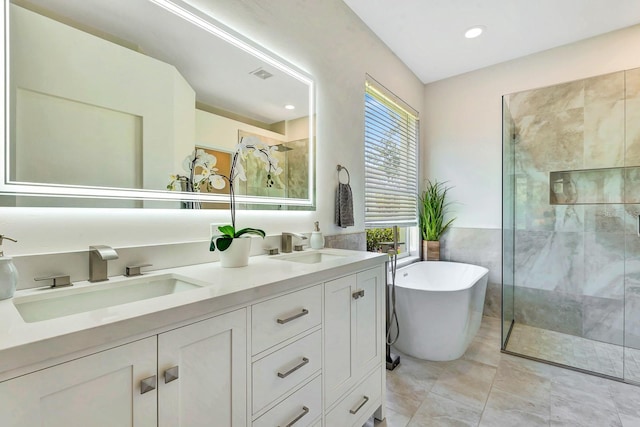 6364 Golden Eye Gln, Lakewood Ranch, FL 34202 - full bath featuring a stall shower, double vanity, a freestanding bath, and recessed lighting