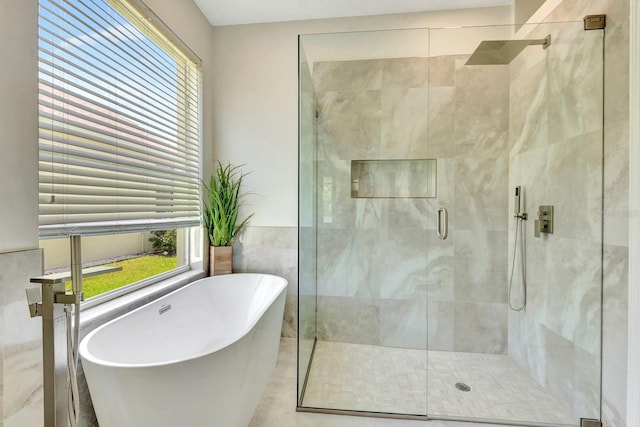 6364 Golden Eye Gln, Lakewood Ranch, FL 34202 - bathroom featuring a stall shower and a soaking tub
