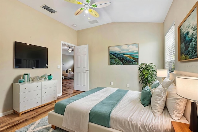 6364 Golden Eye Gln, Lakewood Ranch, FL 34202 - bedroom with light wood finished floors, vaulted ceiling, and ceiling fan