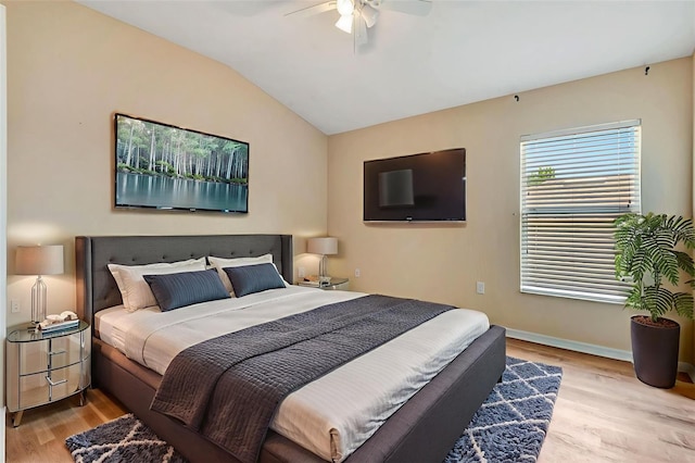 6364 Golden Eye Gln, Lakewood Ranch, FL 34202 - bedroom with wood finished floors, lofted ceiling, and a ceiling fan